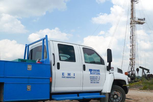 E.M.I. truck at a drilling rig